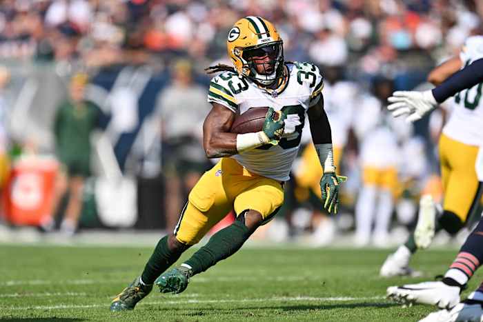 Sep 10, 2023; Chicago, Illinois, USA; Green Bay Packers running back Aaron Jones (33) runs with the ball against the Chicago Bears at Soldier Field.